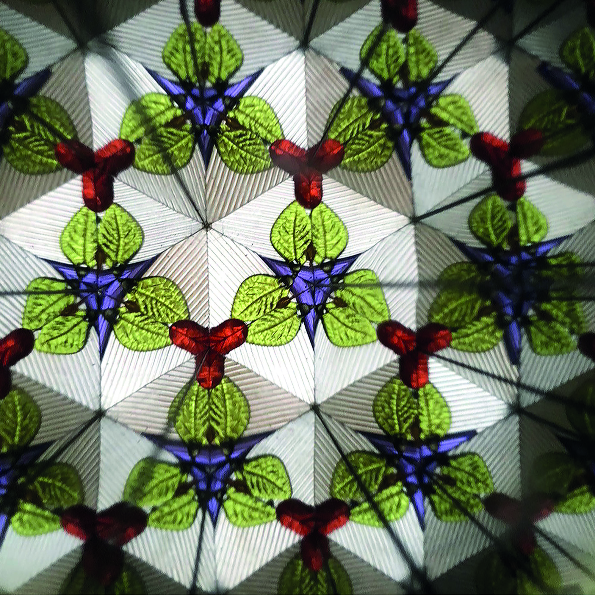 Mintfarbenes Kaleidoskop im Einhorn-Design, mit einem symmetrischen bunten Muster aus mehrfach gespiegelten Figuren gezeigt.