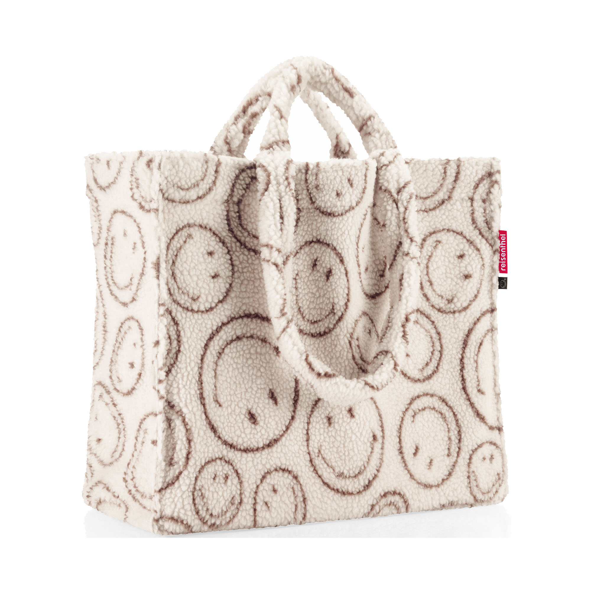 Shopper von Reisenthel, Modell Softshopper, in Creme und Braun mit Smiley-Muster aus Teddyfleece, von der Seite mit sichtbarem Taschenvolumen