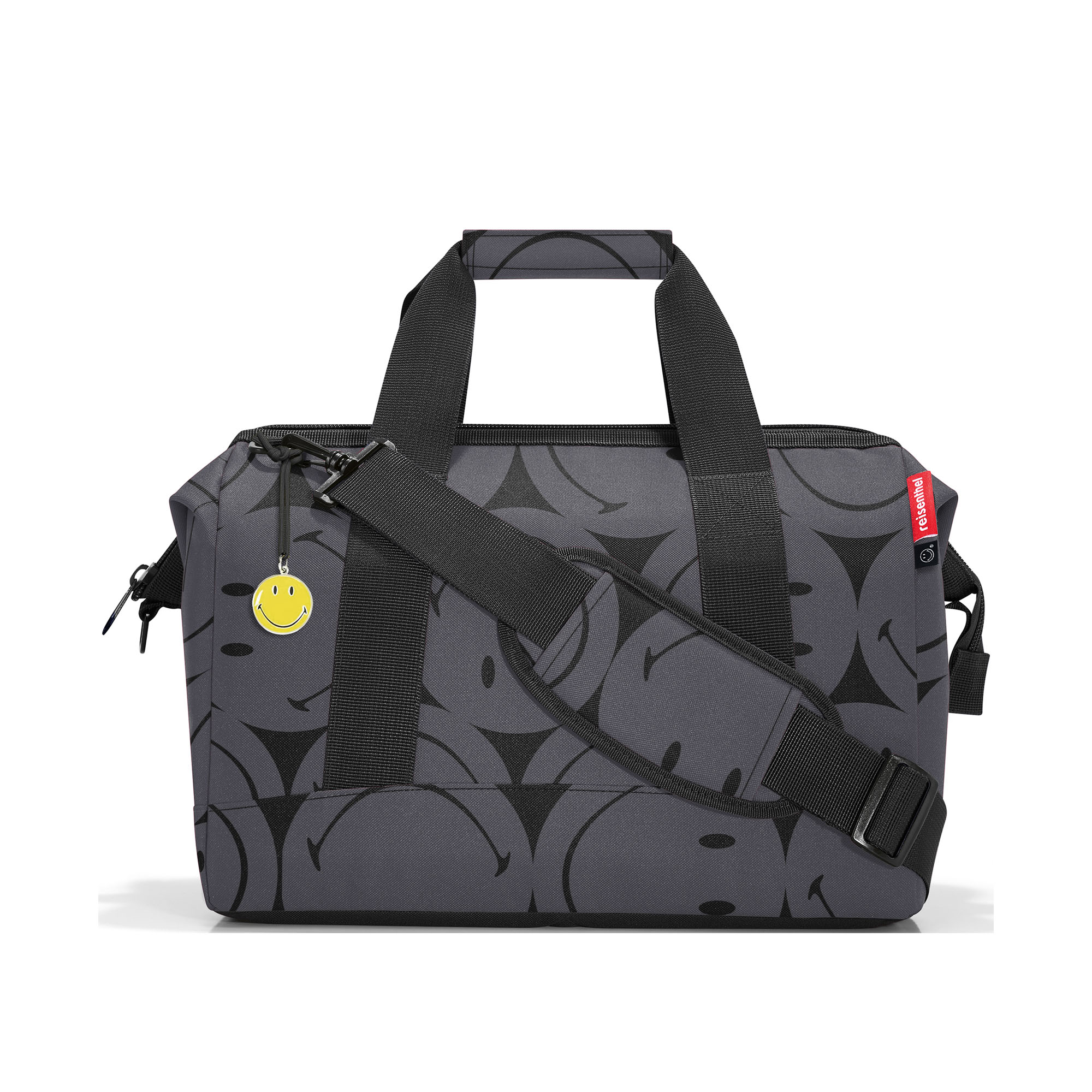 Reisetasche von Reisenthel, Modell Allrounder M, in Grau mit großflächigem Smiley-Muster, seitlich von vorn mit Tragegriffen und Schultergurt.