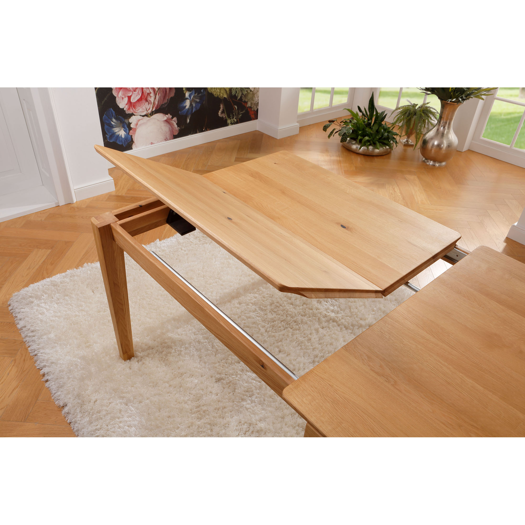Quadratischer Esstisch aus Holz mit ausgezogener Tischplatte und sichtbarer Erweiterung in Draufsicht