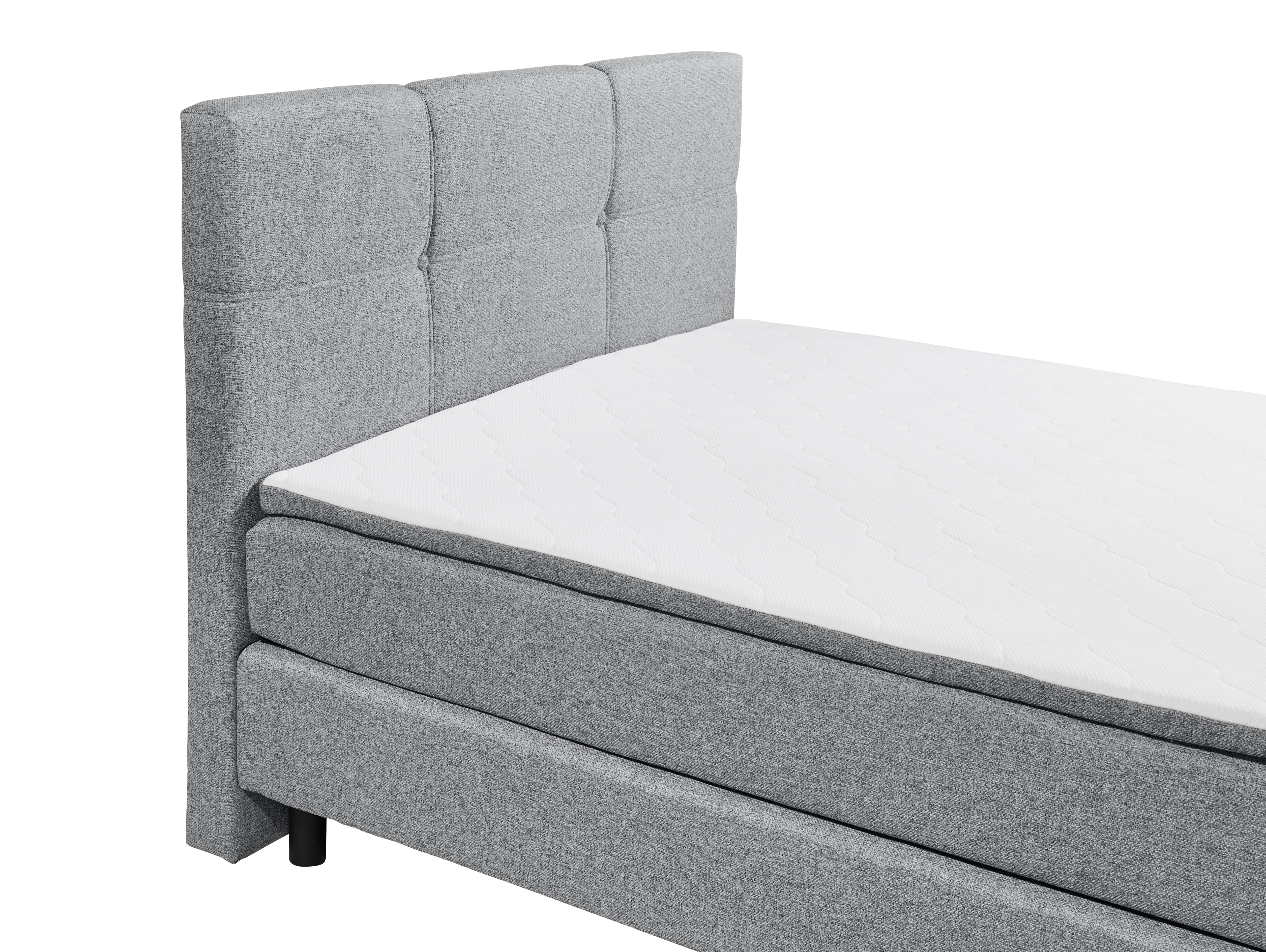 Boxspringbett „Lumos 08 grey“ aus schräger Perspektive, Fokus auf Kopfteil und Matratze, Details des grauen Stoffbezugs und der Metallfüße sichtbar