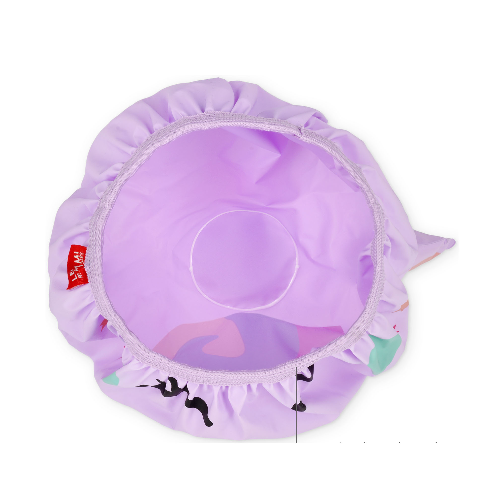 Lilafarbene Duschhaube im Einhorn-Design, von innen mit Futter und umlaufendem Gummizug dargestellt.