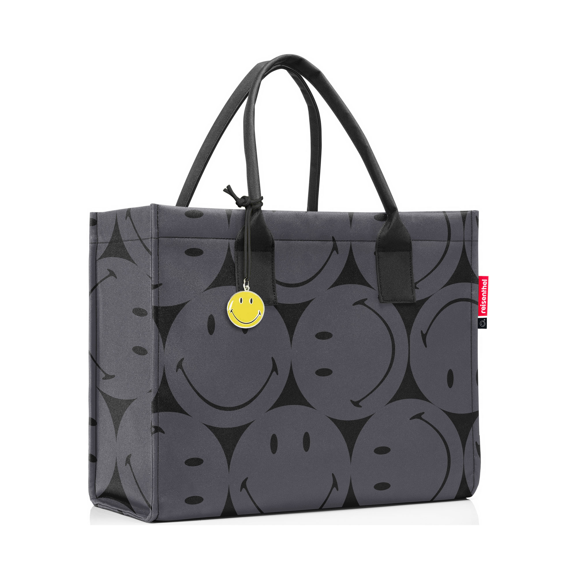 Shopper von Reisenthel, Modell Daily Shopper, in Grau mit großflächigem Smiley-Muster, schräg von vorn mit zwei langen Tragegriffen und Smiley-Anhänger.