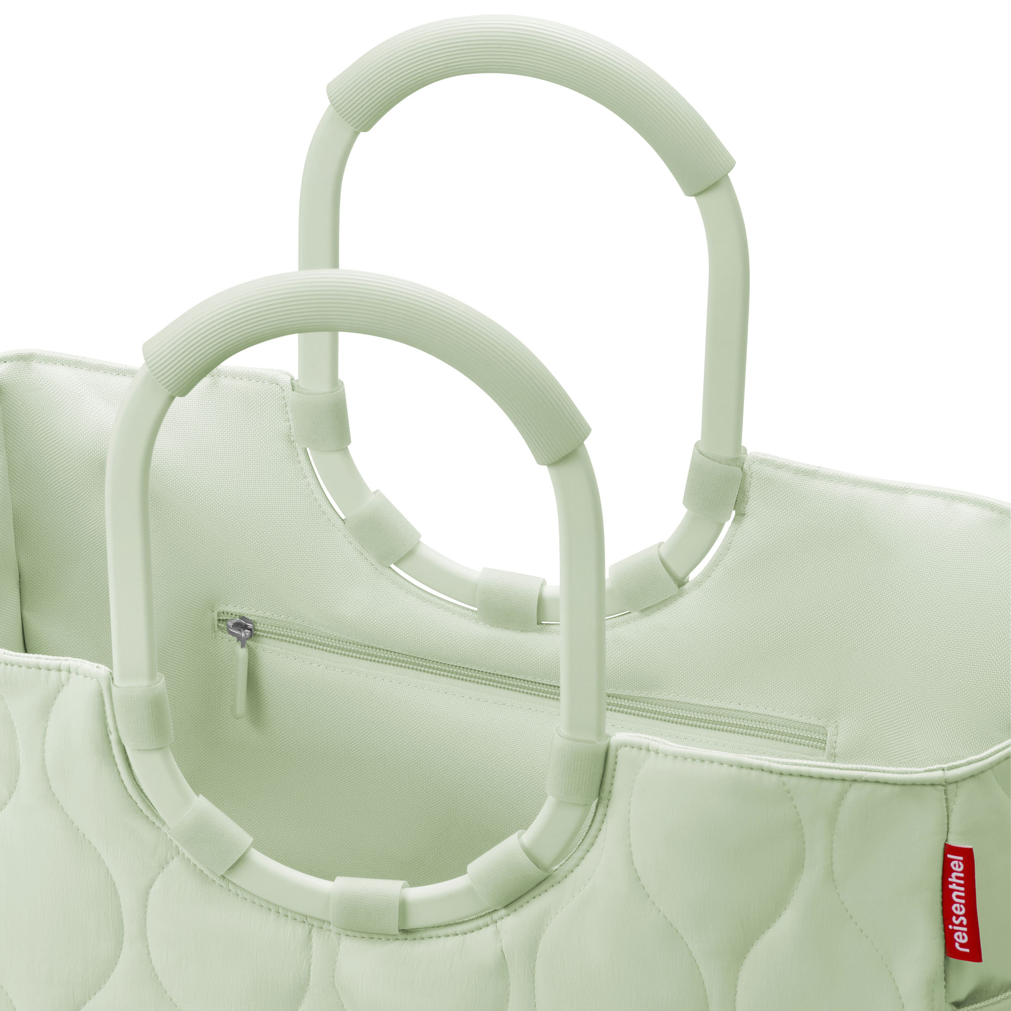 Shopper mit Ringgriffen von Reisenthel, Modell Loopshopper L, in Hellgrün mit Steppstruktur, Nahaufnahme der Ringgriffe und des oberen Innenraums
