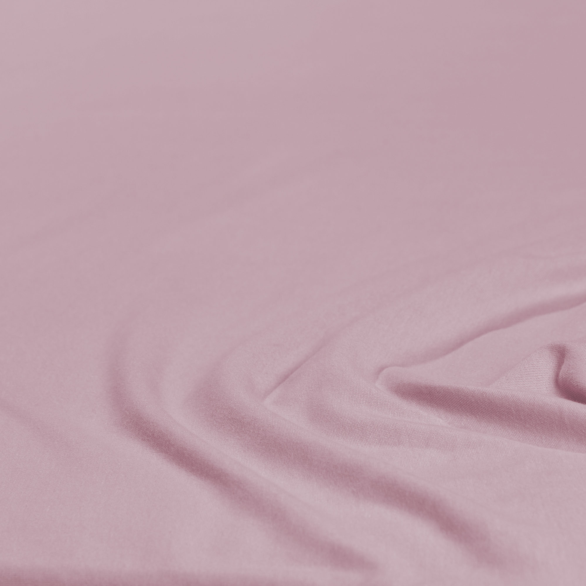 Nahaufnahme des Stoffes in Mauve mit leichten Falten; Farbe und Oberflächenstruktur des Produkts sind erkennbar; Größe 100 x 200 x 30 cm.