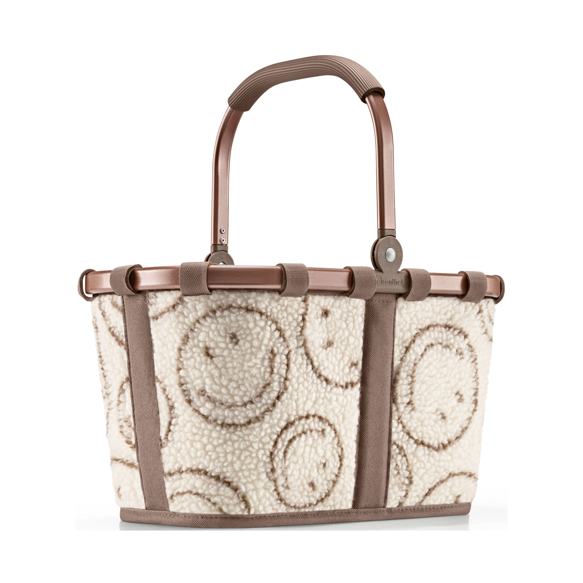 Kleiner Einkaufskorb von Reisenthel, Modell Carrybag XS, in Creme und Braun mit Smiley-Muster aus Teddyfleece, frontal mit hochgestelltem Tragegriff