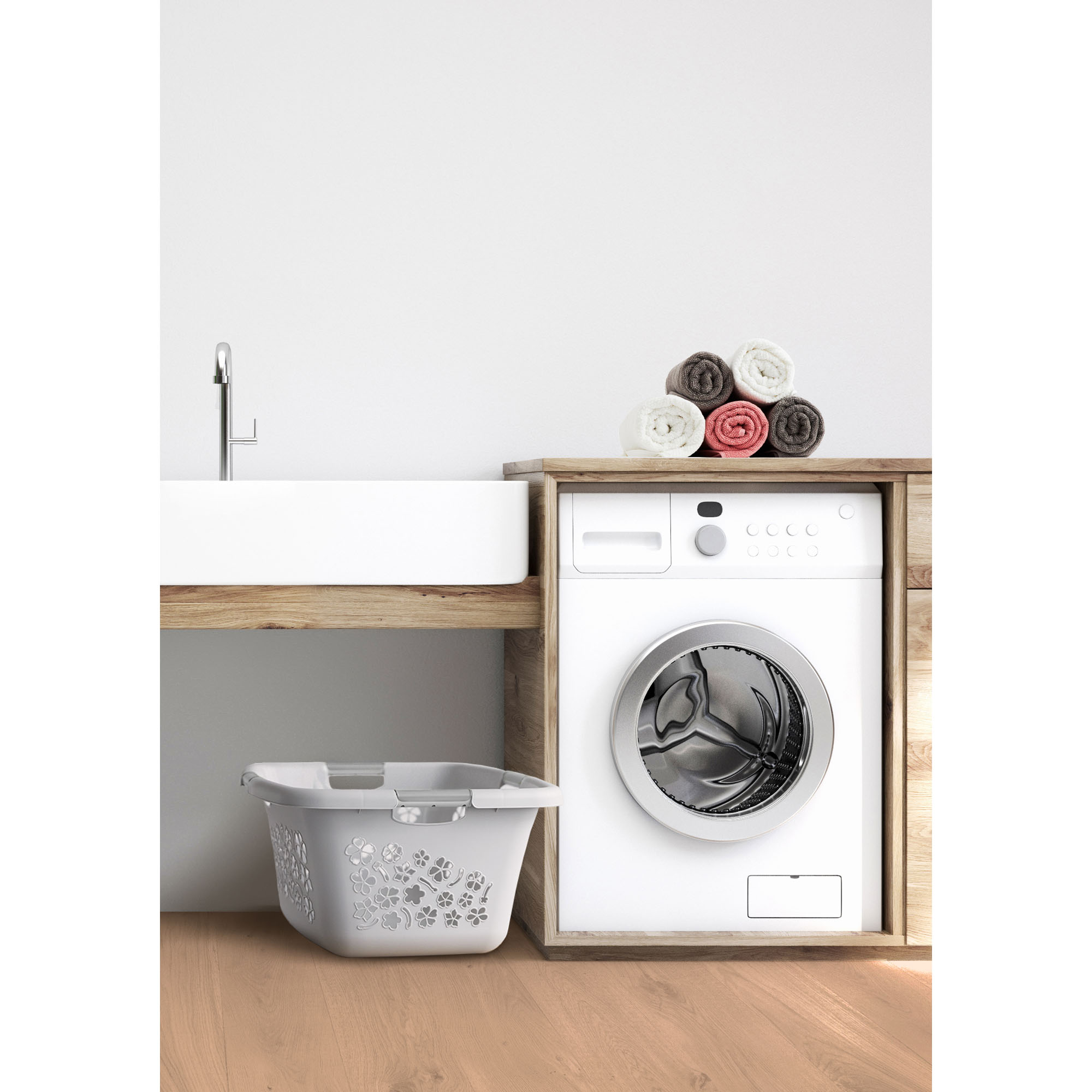Grauer Wäschekorb auf dem Boden vor einer Waschmaschine und einem Unterschrank