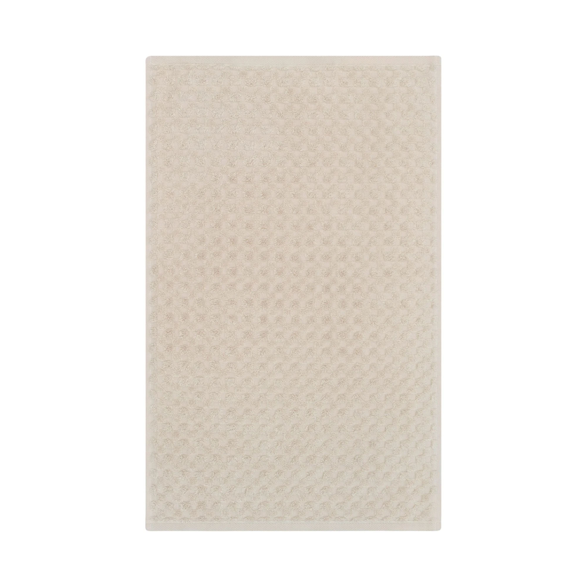 Gästetuch in der Farbe Travertin, flach auf weißem Hintergrund gezeigt; die fein geometrisch strukturierte Oberfläche ist über die gesamte Fläche sichtbar.