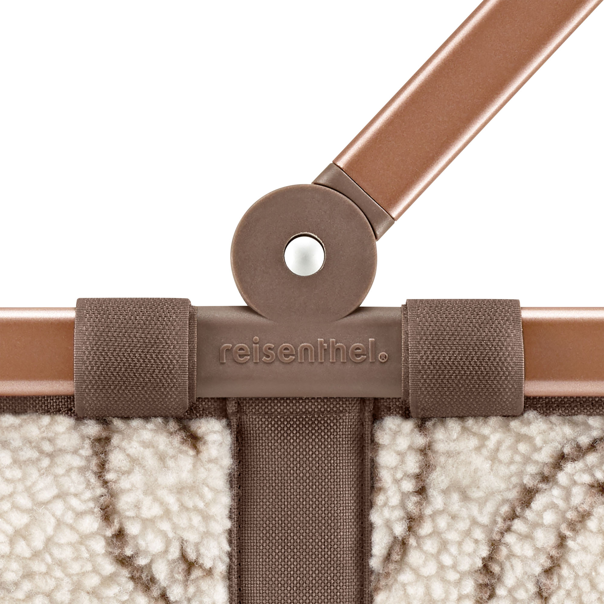 Einkaufskorb von Reisenthel, Modell Carrybag, in Creme und Braun mit Smiley-Muster aus Teddyfleece, Nahaufnahme des Gelenks am Aluminiumgriff