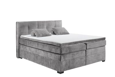 Boxspringbett „Vogue 15 grey“ mit Tonnentaschenfederkern-Matratze, Bettkasten und Kunststofffüßen, Liegefläche 180x200 cm, schräg fotografiert, dekoriert mit Kissen