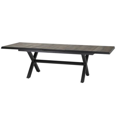 Der Tisch ist vollständig zusammengeschoben, Holzplatte in grauer Optik und schwarzes Gestell erkennbar.