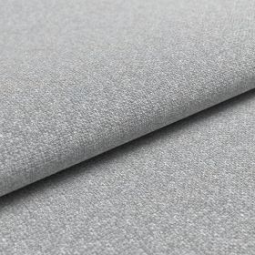 Detailaufnahme der fein gewebten Stoffstruktur des Sofabezugs