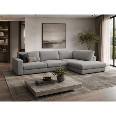 Großzügiges Ecksofa in Grau mit rechter Liegefläche, dargestellt in einem modernen Wohnzimmer mit Teppich, Couchtisch und großer Fensterfront.