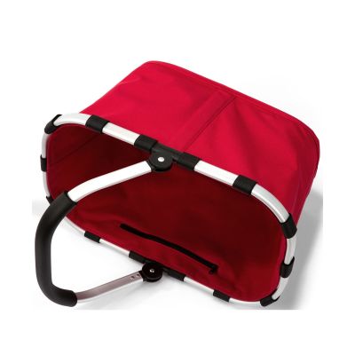 Einkaufskorb von Reisenthel, Modell Carrybag, in Rot, auf die Seite gelegt mit sichtbarem Rahmen und eingeklapptem Griff.