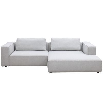 Modulares Ecksofa in beige mit Rückenkissen
