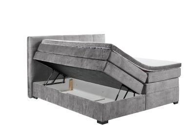 Boxspringbett „Vogue 15 grey“ aus schräger Perspektive, Bettkasten geöffnet, Stauraumfunktion sichtbar
