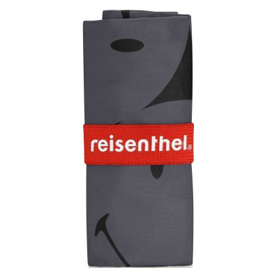 Faltbare Einkaufstasche von Reisenthel, Modell Mini Maxi Shopper, in Grau mit großflächigem Smiley-Muster, kompakt gefaltet in einer grauen Hülle mit rotem Reisenthel-Band.