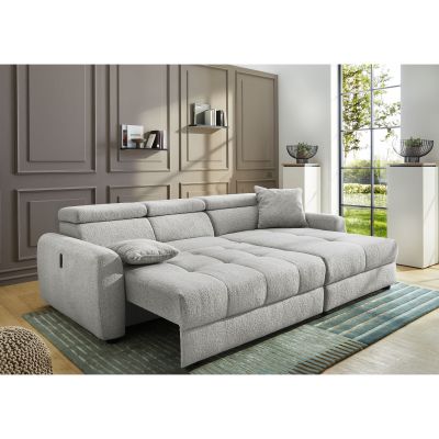 Detailaufnahme eines hellgrauen Ecksofas mit integriertem USB-Anschluss zum Laden eines Smartphones
