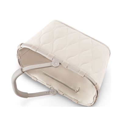 Einkaufskorb von Reisenthel, Modell Carrybag, in hellem Steinbeige mit Steppstruktur, seitlich zusammengeklappt dargestellt