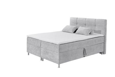Boxspringbett „Curio 80 Silver“ mit Schaum-Topper, Bettkasten und Liegefläche 180x200 cm, aus schräger Perspektive fotografiert, dekoriert mit Kissen