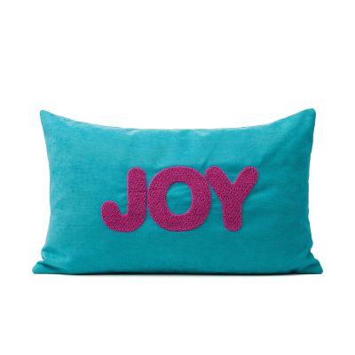 Türkisfarbene Kissenhülle mit dem pinken Schriftzug „JOY“, ca. 30 × 50 cm.