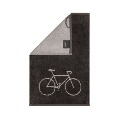 Dunkles Gästetuch Postcard Towels in Basalt mit hellem Fahrradmotiv und grau-beiger umgeschlagener Ecke.