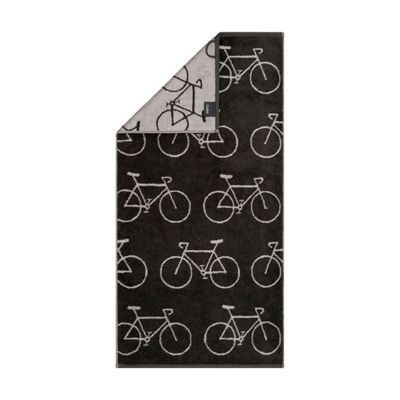 Handtuch Velo in Basalt mit wiederholten hellen Fahrradzeichnungen; eine obere Ecke zeigt die Rückseite.