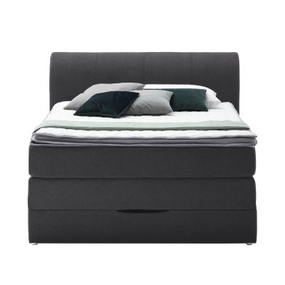 Boxspringbett in Frontansicht mit durchgehendem Kopfteil und aufliegender Matratze mit Topper
