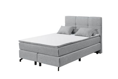 Modernes Boxspringbett „Lumos 08 grey“ mit Komfort-T25-Schaum-Topper und Tonnentaschenfederkern-Matratze, 140x200 cm Liegefläche, aus schräger Perspektive fotografiert, dekoriert mit Kissen