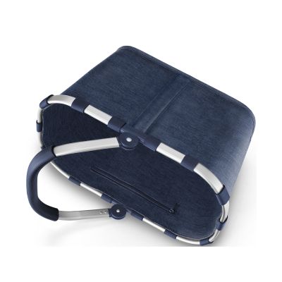 Einkaufskorb von Reisenthel, Modell Carrybag, in Dunkelblau mit melierter Struktur, auf die Seite gelegt mit sichtbarem Rahmen und eingeklapptem Griff.