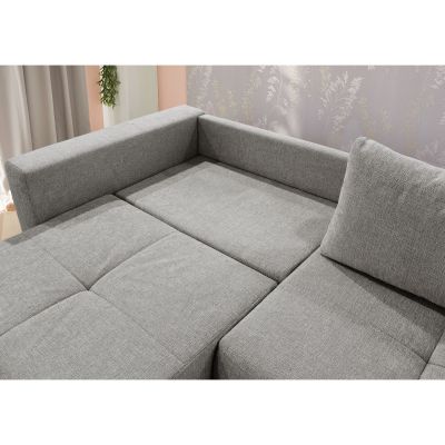 Detailaufnahme des grauen Schlafsofas mit gepolsterter Rückenlehne und großzügiger Liegefläche