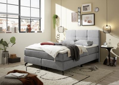 Boxspringbett „Lumos 08 grey“ mit Metallfüßen, in einem eingerichteten Schlafzimmer