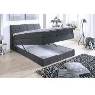 Boxspringbett mit seitlich aufgeklappter Liegefläche und sichtbarem Bettkasten zur Aufbewahrung